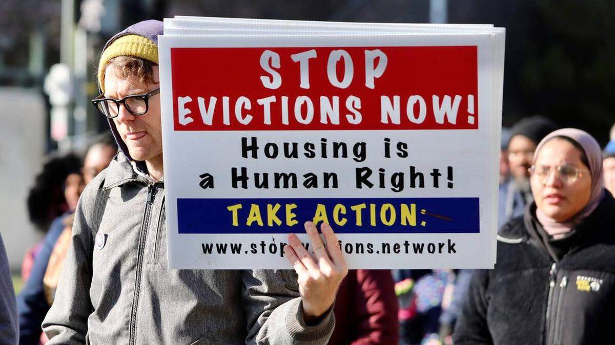Posters reading “STOP Evictions Now!” were handed out during a Martin Luther King Jr. Day Unity March and Rally in Durham. COVID-19 has decimated the economy, leaving millions of tenants across the U.S. without the income they need to make rent.