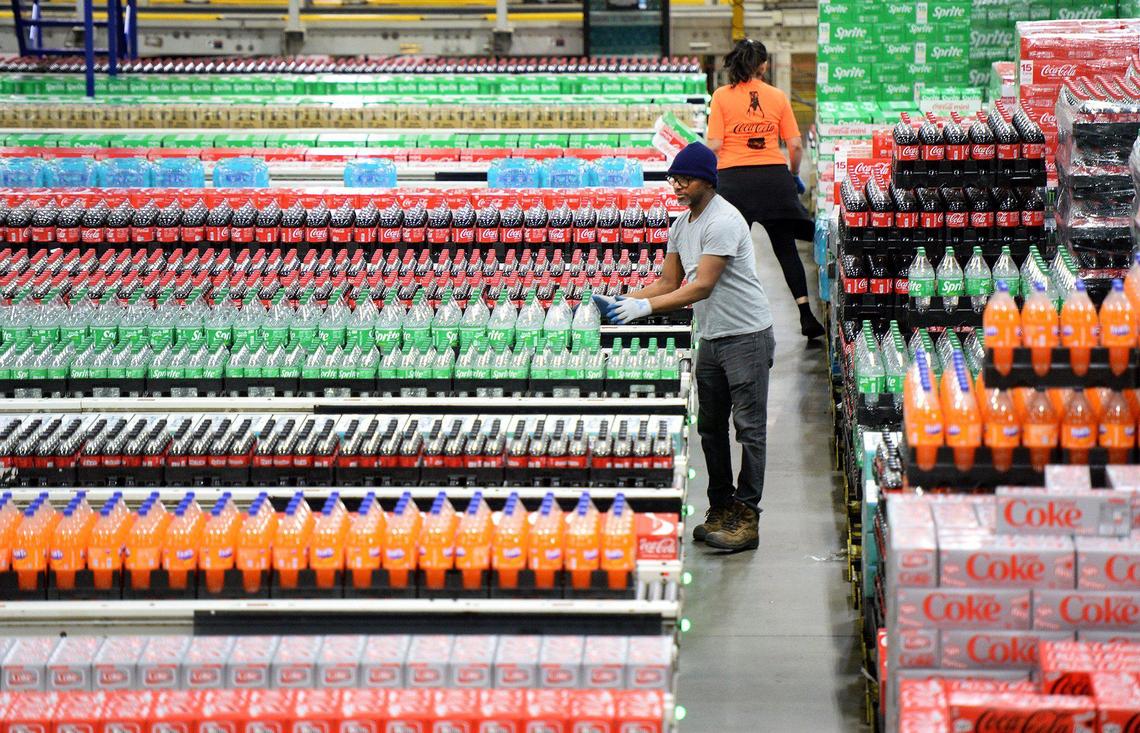 Pallets of various Coca-Cola product inventory wait to be sorted for specific orders in the automated warehouse at the Vertique Distribution Center. Hoping to raise the profile of product manufacturing in the state the North Carolina Chamber’s manufacturing tour made a stop at Coca-Cola Consolidated, in Charlotte, to visit its Learning Center, Snyder Production Facility and Vertique Distribution Center on Wednesday, Mar. 19, 2025. The full process of how a Coca-Cola beverage goes from production to the store shelf was demonstrated on the tour.