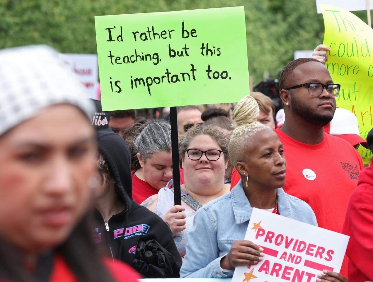 Signs, signs, signs were everywhere as teachers rallied at the Government Complex in Raleigh.