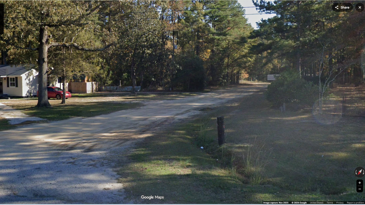 The body was discovered in the 100 block of Dogwood Trails Road, a dirt road near Parkton, North Carolina, officials say. 