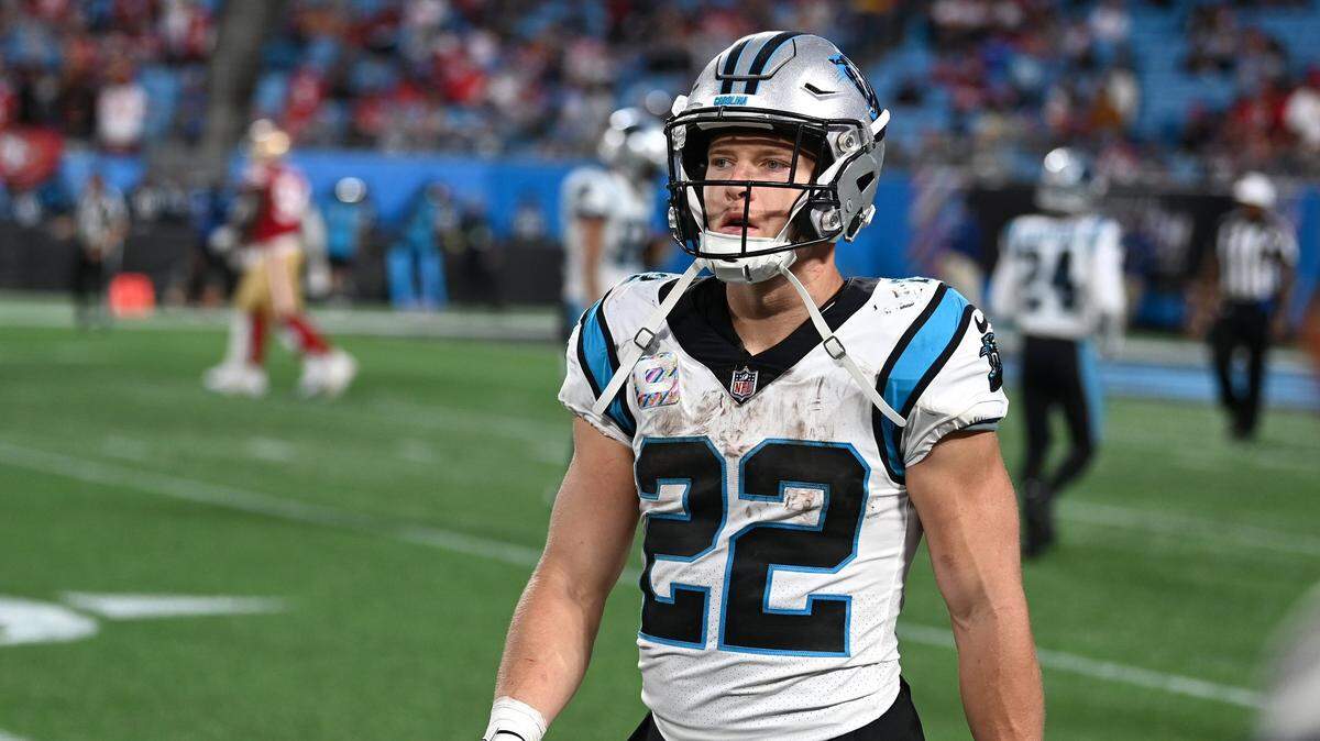 Carolina Panthers running back Christian McCaffrey walks off the field after a series against the San Francisco 49ers on Oct. 9, 2022. Only 11 days later, the 49ers traded for McCaffrey, giving Carolina four draft picks in return.
