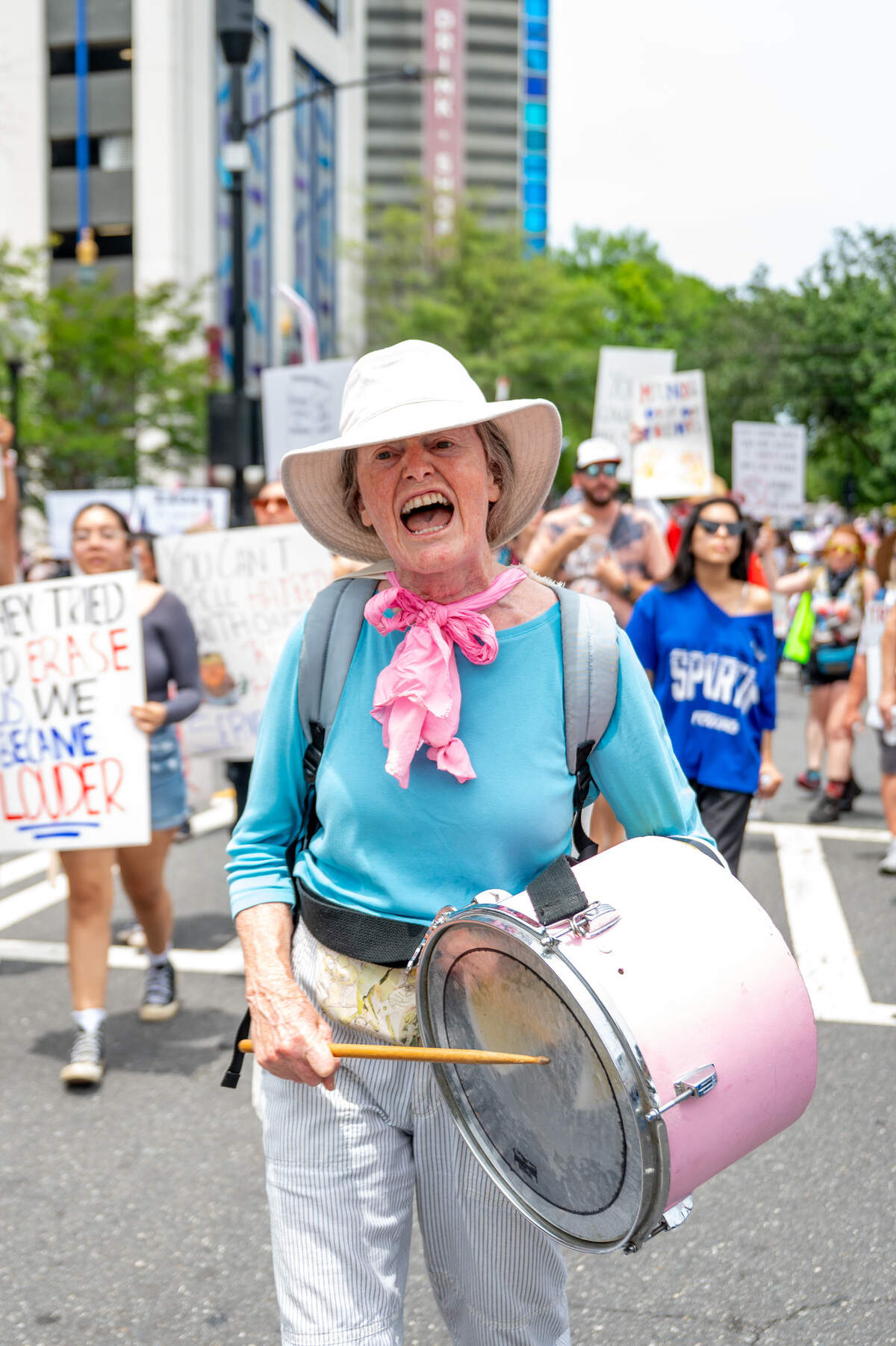Maggie Davis plays a drum in sync with the crowd’s chants during the No Kings march and rally in Charlotte Saturday, June 14, 2025.