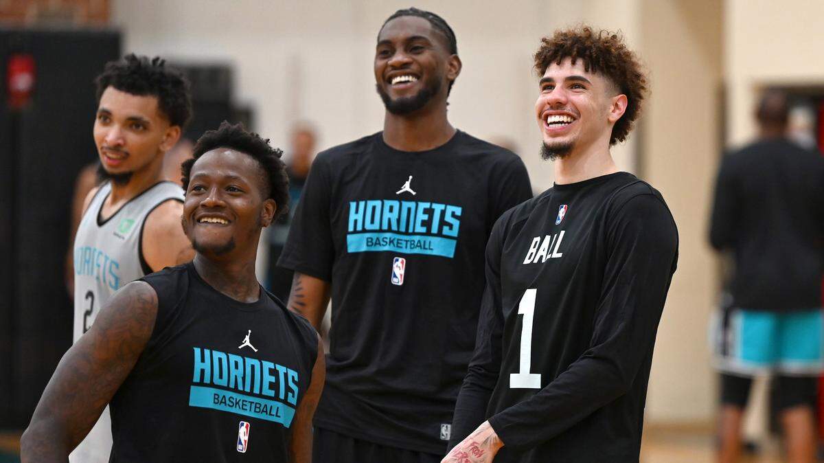(L-R) Charlotte Hornets guards James Bouknight, Terry Rozier, forward Jalen McDaniels and guard LaMelo Ball laugh as they participate in an after practice shoot around on Tuesday, September 27, 2022.