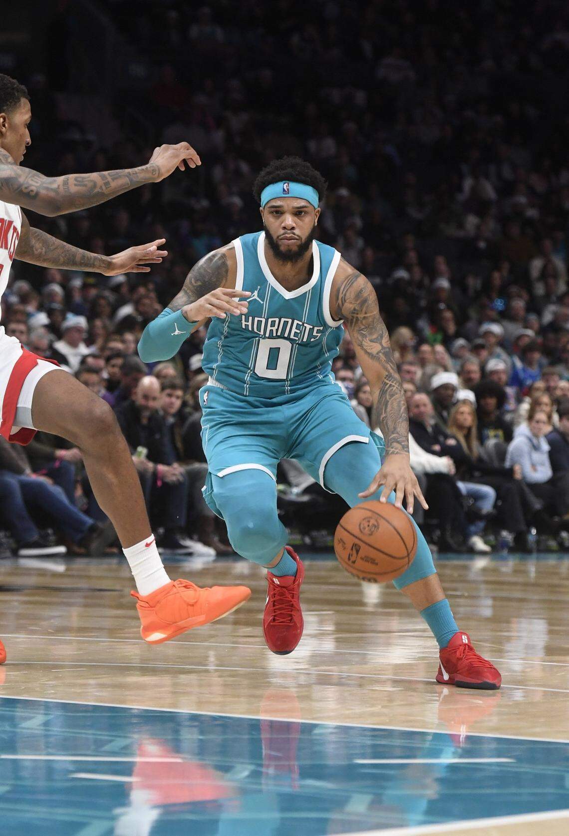 Charlotte Hornets forward Miles Bridges (0) drives in during the first half against the Charlotte Hornets at the Spectrum Center.