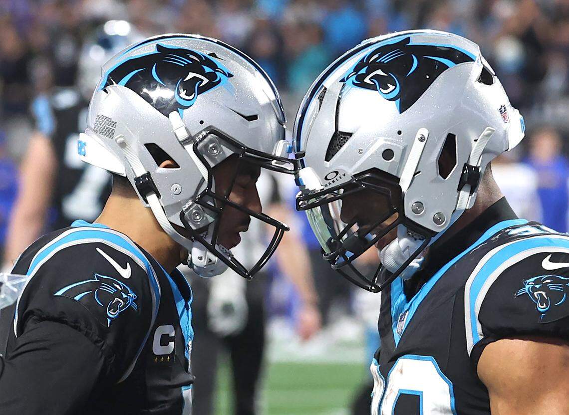 Carolina Panthers quarterback Bryce Young and running back Chuba Hubbard, right, celebrate Hubbard’s touchdown run against the Los Angeles Rams at Bank of America Stadium on Saturday, January 10, 2026. The Rams defeated the Panthers 34-31.