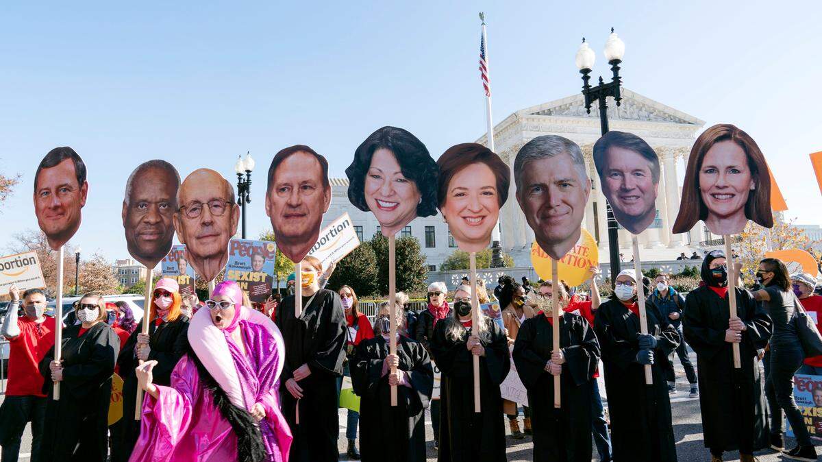 Abortion rights advocates holding cardboard cutouts of the Supreme Court Justices, demonstrate in front of the U.S. Supreme Court on Dec. 1, 2021 in Washington.