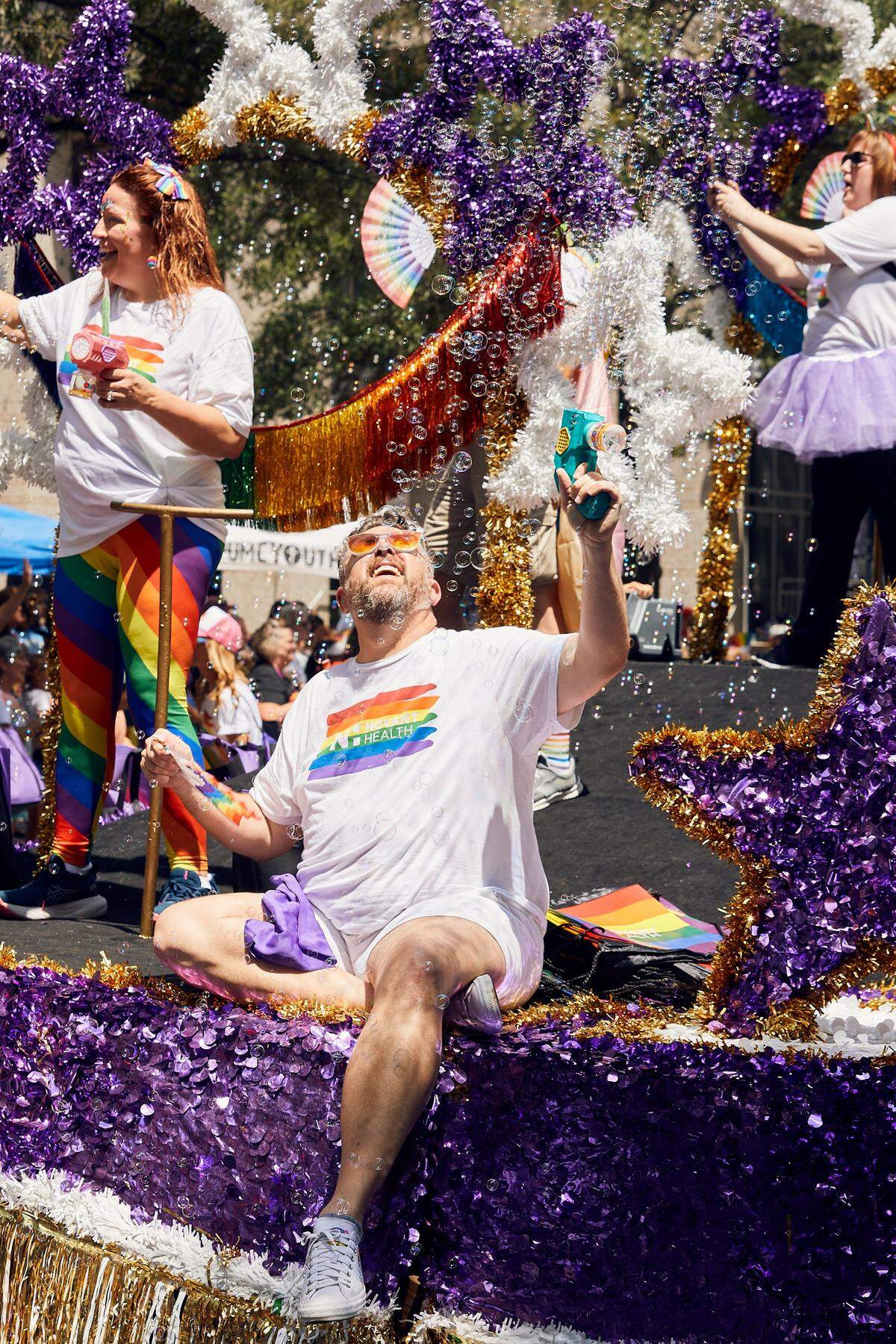 Novant Health brings out the bubble machines as their parade float moves down North Tyron Street during the 25th Charlotte Pride Parade in uptown Charlotte on August 17, 2025.