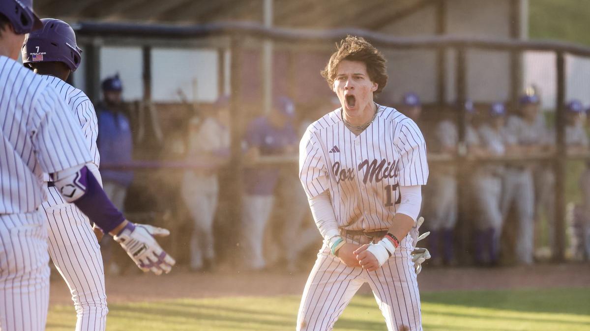 Cox Mill Chargers Cruise Ungaro celebrates against the Lake Norman Wildcats at Cox Mill High School in Concord, N.C., on Friday, April 12, 2024.