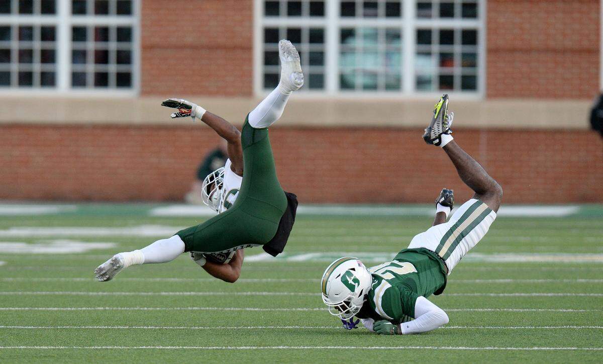 UAB running back, #29, Lee Beebe, is upended by Charlotte’s, #20, Trevon Booker, in the first half on Saturday, Nov. 30, 2024.