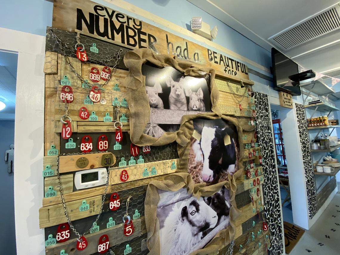A wall at Oh My Soul features tags that were once used to identify animals for slaughter. “Every number had a beautiful face,” is written across the wall along with images of pigs, cows and sheep.&nbsp;