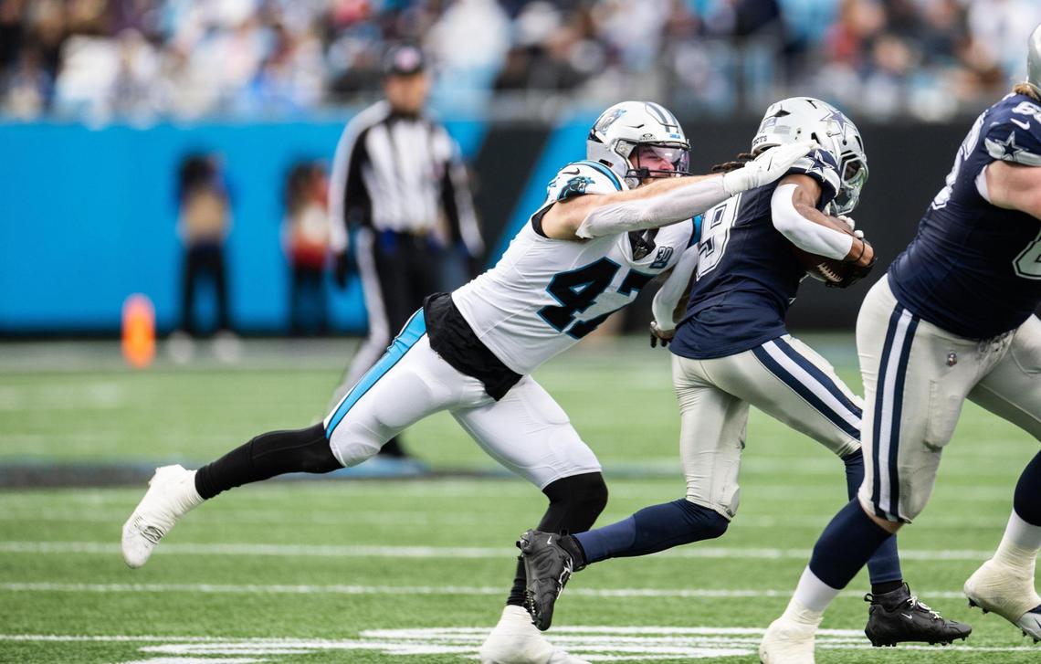Carolina Panthers linebacker Josey Jewell, left, tackles Dallas Cowboys wide receiver KaVontae Turpin at the Bank of America Stadium in Charlotte, N.C., on Sunday, December 15, 2024.