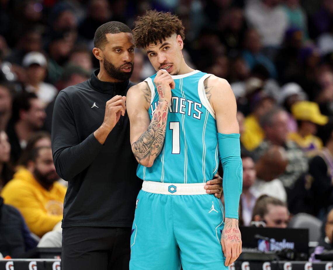 Charlotte Hornets head coach Charles Lee, left, speaks with guard LaMelo Ball, right, during action against the Los Angeles Lakers at Spectrum Center in Charlotte, NC on Monday, January 27, 2025.