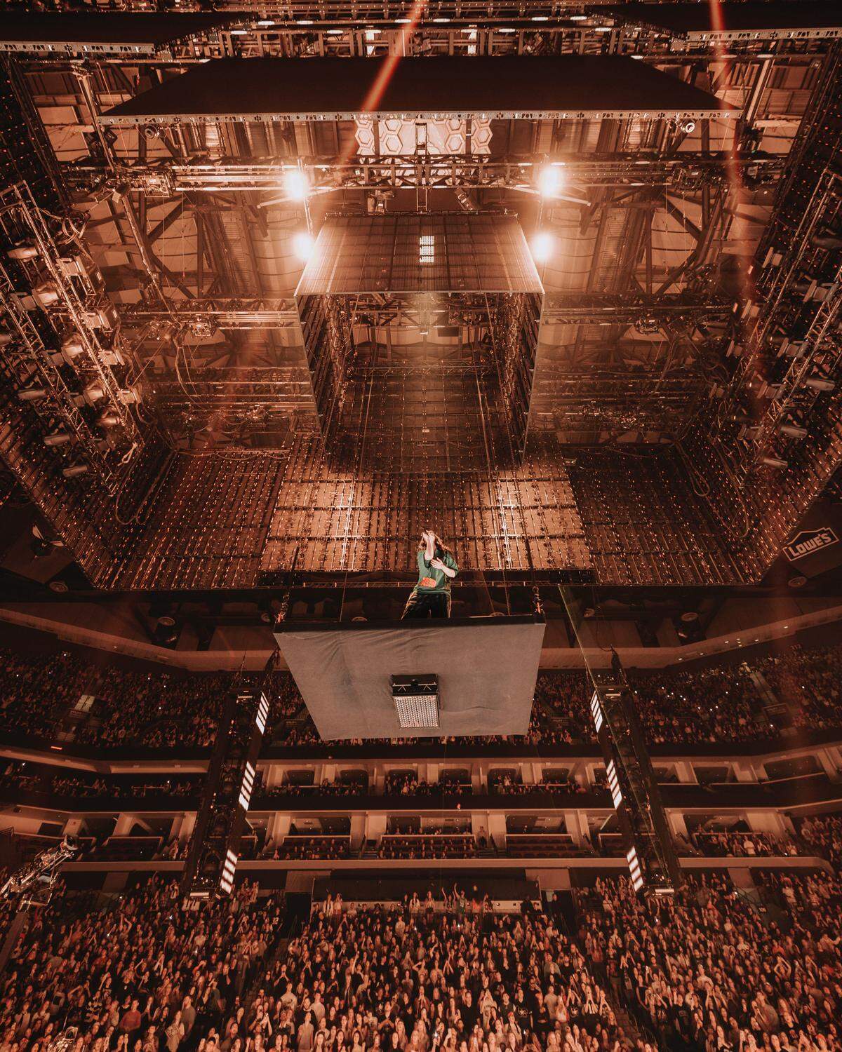 Billie Eilish performs on a floating platform during her first night in Charlotte on her “Hit Me Hard and Soft Tour” on Sunday, Oct. 19, 2025.