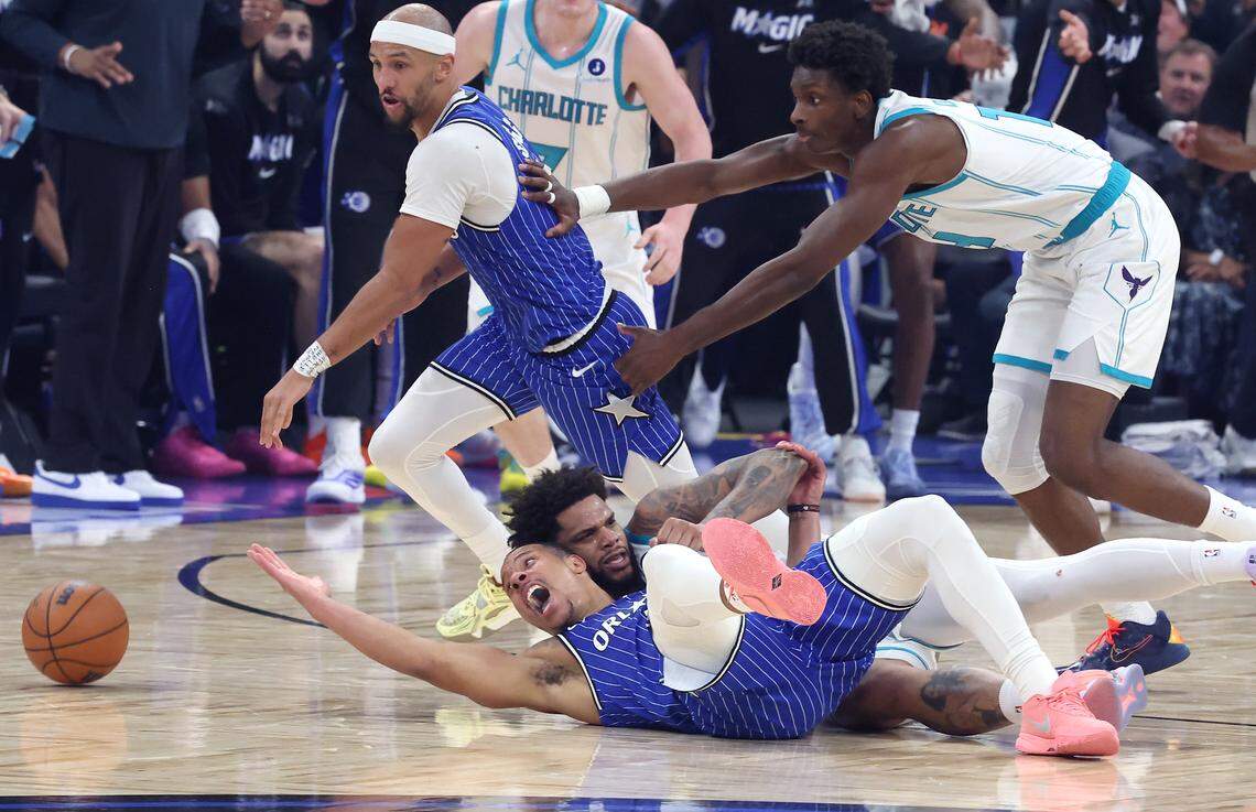 Orlando Magic guard Desmond Bane, left, stretches out trying to regain control of a loose ball with Charlotte Hornets forward Miles Bridges, right, during action at Kia Center in Orlando, FL on Friday, April 17, 2026.