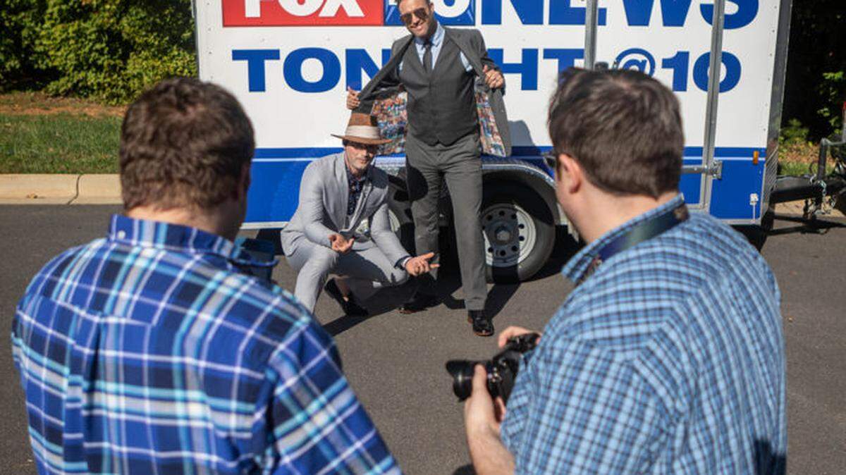 Fox 46’s Nick Kosir and Jason Harper being photographed by news directors Hans Fornoff and Jake White as part of the #dripchronicles in October.