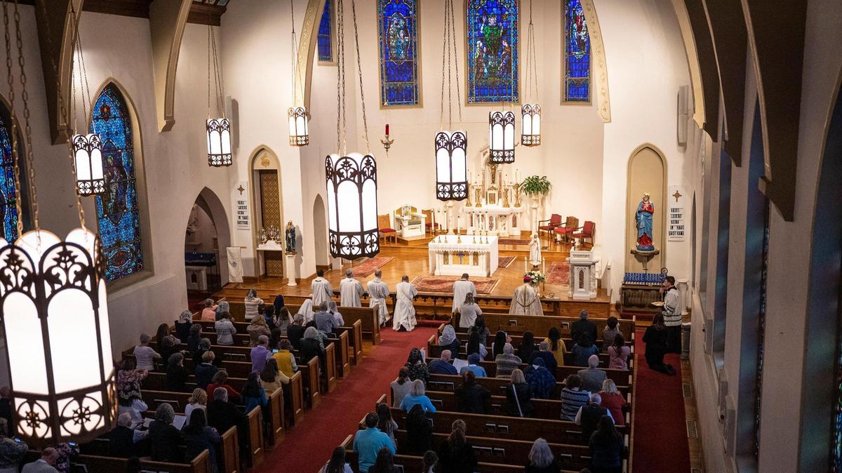 Bishop Peter Jugis leads a congregation in a prayer service for peace in Ukraine at St. Patrick Cathedral on Friday, March 25, 2022 in Charlotte, NC. This prayer was part of a worldwide effort along with Catholic churches across North Carolina to join Pope Francis’ prayer for peace in Ukraine. Bishop Jugis participated with bishops around the world in accepting the pope’s invitation for all to pray for peace through a special “consecration” prayer offered simultaneously around the world.
