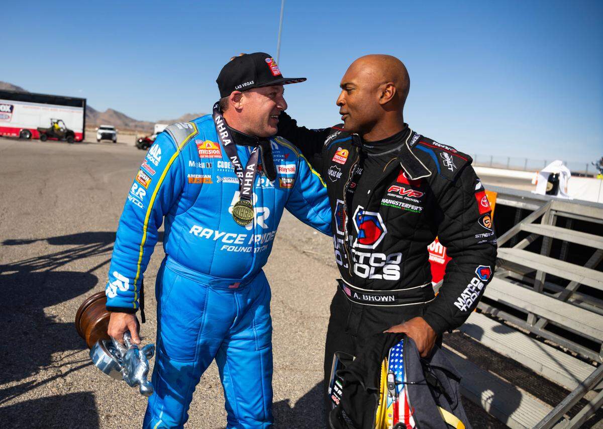 Apr 13, 2025; Las Vegas, NV, USA; NHRA top fuel driver Tony Stewart (left) is congratulated by Antron Brown after winning the Four Wide Nationals at The Strip at Las Vegas Motor Speedway. The win is the first of Stewart’s professional drag racing career.