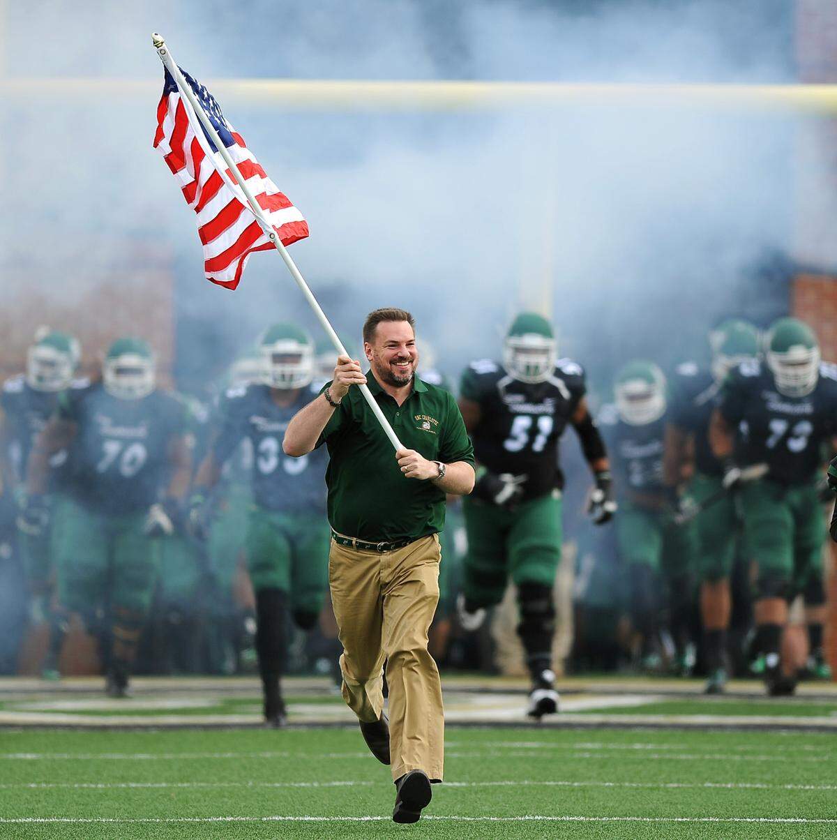 Congressman Richard Hudson leads the Charlotte 49ers football team onto the McColl-Richardson Field at Jerry Richardson Stadium in 2015. National Republican groups are spending millions to boost him in his first competitive race as the Concord area’s Congressman.
