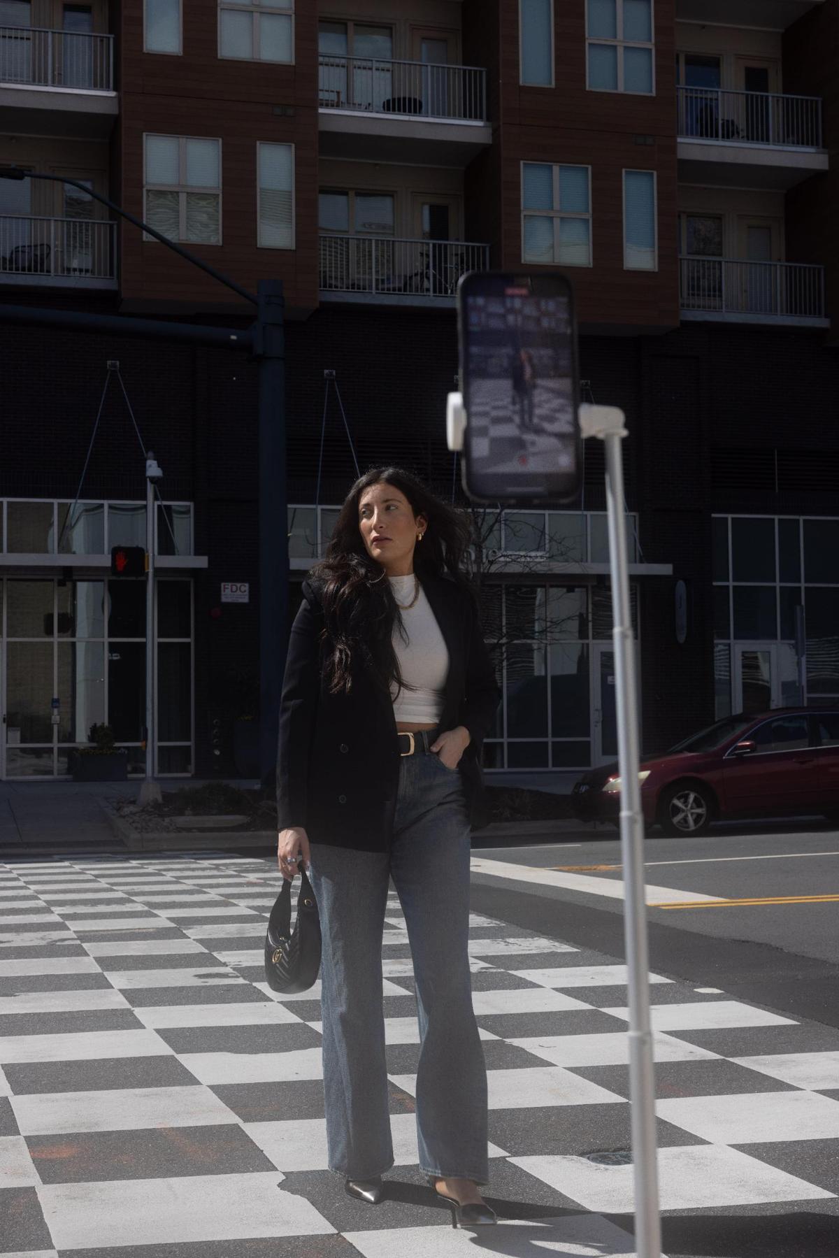 Charlotte influencer Sydney Bernhardt films content in uptown in Charlotte.