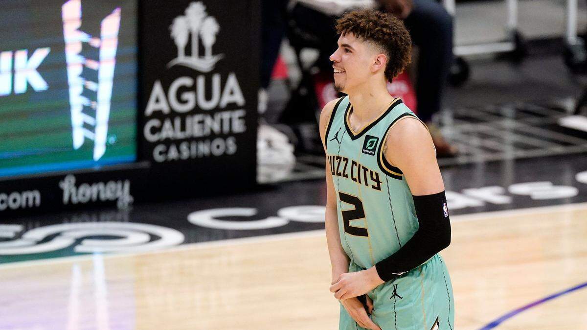 Charlotte Hornets guard LaMelo Ball holds his right wrist after injuring himself in a fall March 20 against the Los Angeles Clippers. An MRI detected a fracture, and Ball had surgery March 23 in New York. Wrist injuries are common in basketball due to falls.