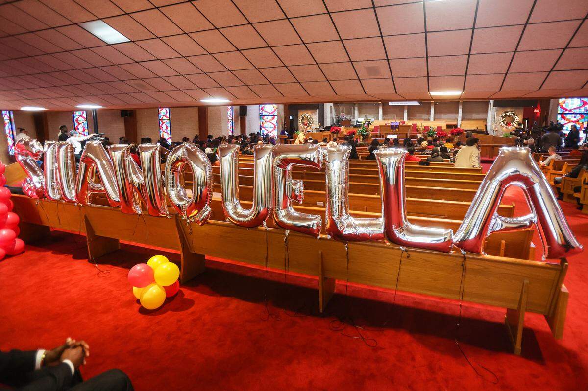 Balloons spelling the name of Shanquilla Robinson decorate the back pew during a rally for justice for Robinson at Little Rock A.M.E. Zion Church on Saturday.