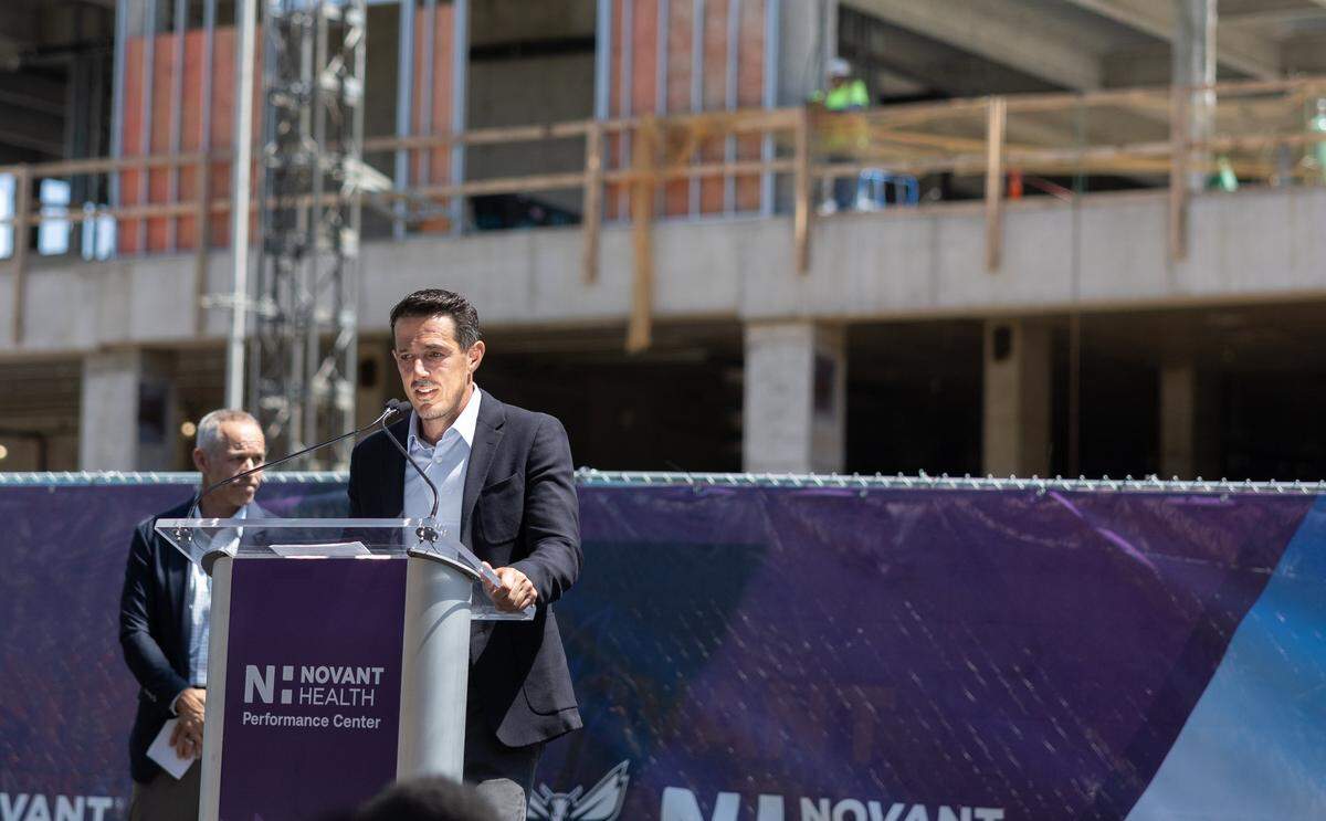 Hornets owner Gabe Plotkin speaks during the Hornets' ceremonial Topping Off Ceremony at Novant Health Performance Center's construction site, celebrating a major milestone, the placement of the building's final structural beam in Charlotte, N.C., on Monday, May 4, 2026.