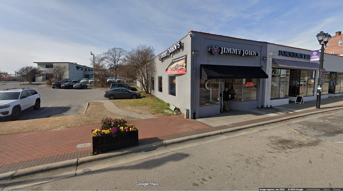 The stabbings occurred in the empty lot next to this Jimmy John’s restaurant in Greenville’s Uptown District, police said.