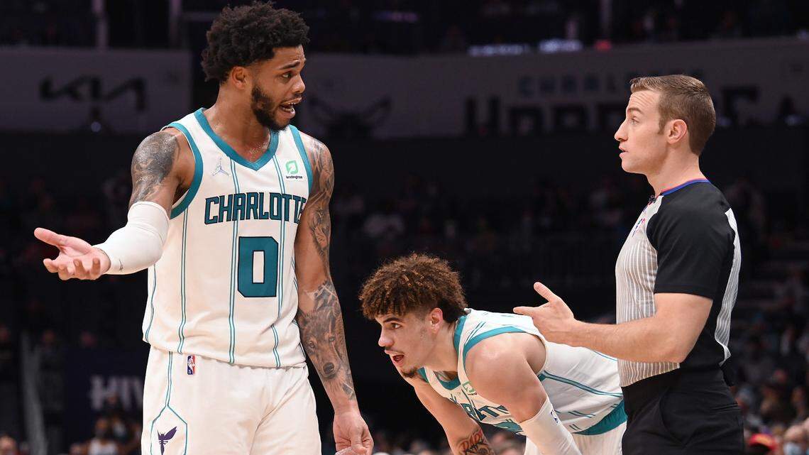 Charlotte Hornets forward Miles Bridges, left, questions a foul call Monday night as LaMelo Ball takes a breather. The Hornets lost, 113-110, and now must go on a 5-game West Coast road trip.
