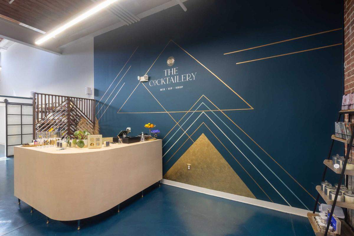 Kelly Copely designed a mural at The Cocktailery, a new cocktail retailer at Atherton Mills.