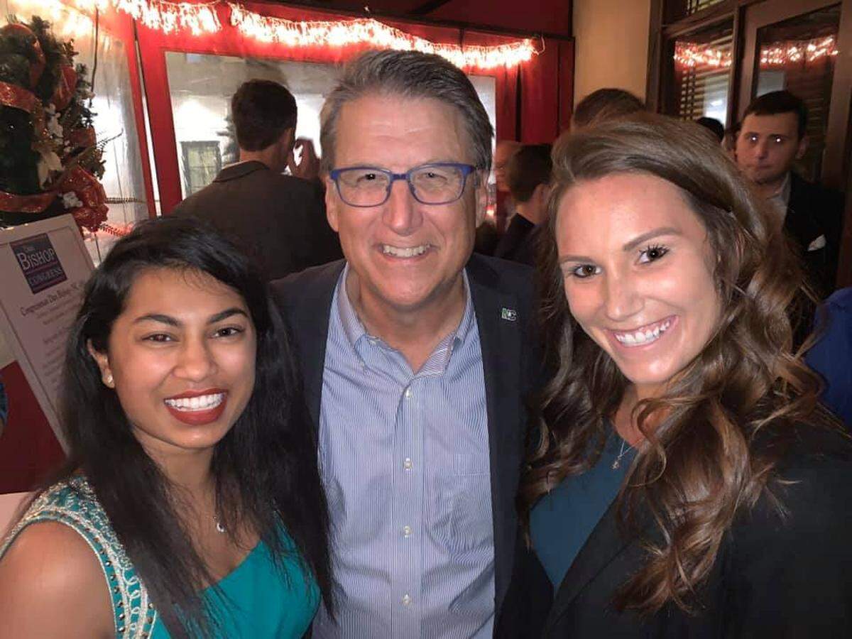 Maya Pillai with former North Carolina Governor Pat McCrory and Ashley Bookout, president of the Charlotte-Mecklenburg Republican Women.