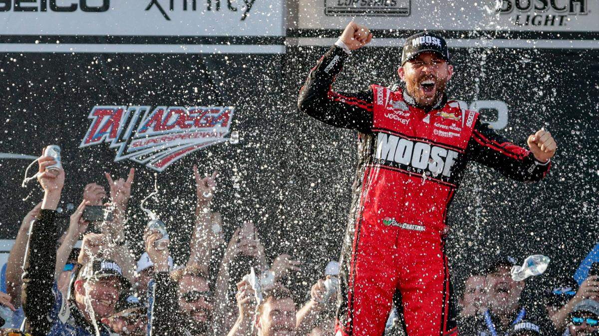 NASCAR Cup Series driver Ross Chastain (1) celebrates the win in Victory Lane following a NASCAR Cup Series auto race, Sunday, April 24, 2022, in Talladega, Ala. (AP Photo/Butch Dill)