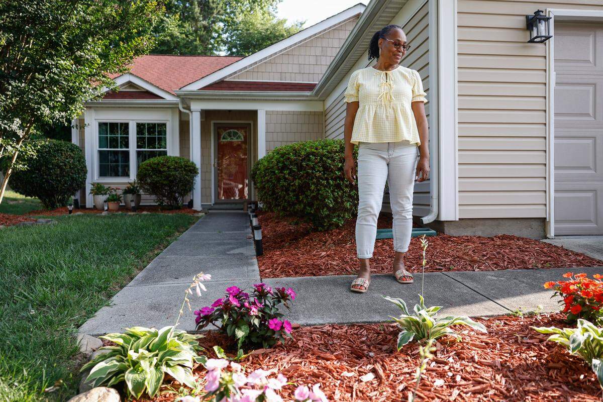Michelle Mitchell stands outside her home, in a development off of Mt. Holly-Huntersville Road. Mitchell moved to the area in 2008 and it has changed vastly. The major concern is safety and congestion along  Mt. Holly-Huntersville Road.