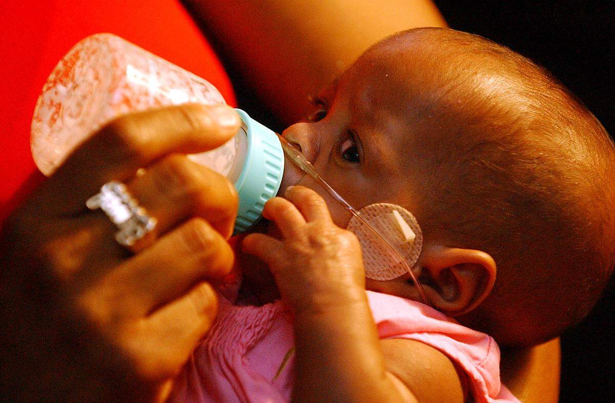 Jada Amiya Wilson looks around as she is fed by her grandmother, Jewel Wilson, in May 2004. Jada was 23 weeks old and weighed 9 ounces at birth. Now 18, she’s set to graduate from East Mecklenburg High School in June 2022.