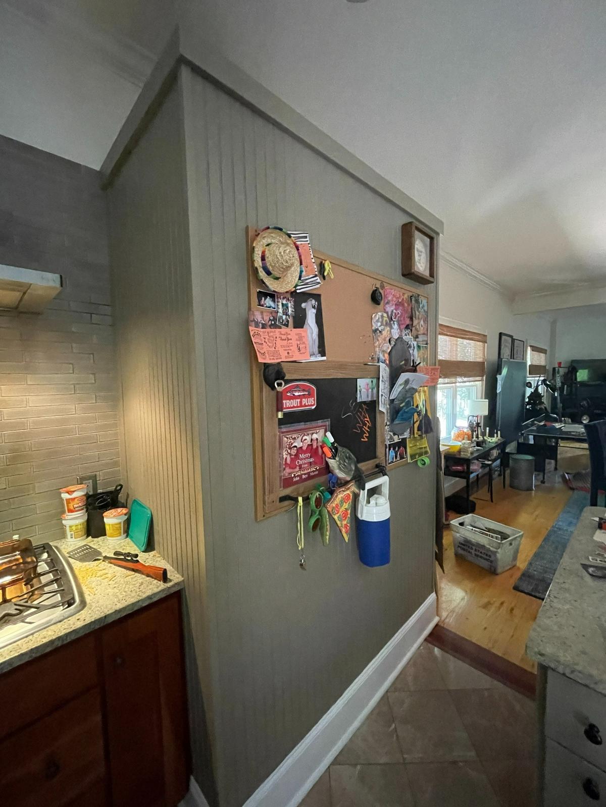 Detail of the kitchen area during filming of “Please Don’t Destroy: The Treasure of Foggy Mountain” in the home of Zack Albert and Becca Bellamy. Spilled pasta and a spatula sit next to the stovetop on the left in an attempt to show what a house shared by three men in their twenties would look like.