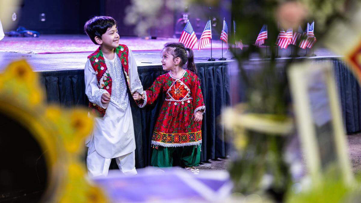 Children play while wearing traditional Persian costumes during the Nowruz Bazaar in Charlotte on Sunday, March 15.
