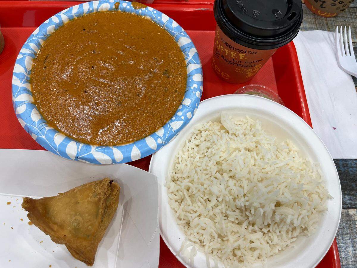 Trivini Supermarket’s butter chicken with rice, samosa and masala tea.