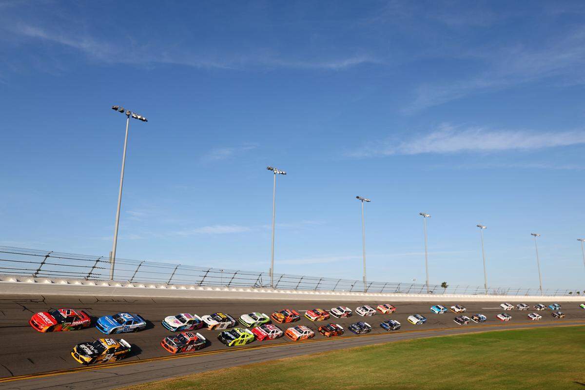 Feb 15, 2025; Daytona Beach, Florida, USA; Xfinity Series driver Taylor Gray (54) and driver Justin Allgaier (7) during the United Rentals 300 at Daytona International Speedway. Mandatory Credit: Peter Casey-Imagn Images