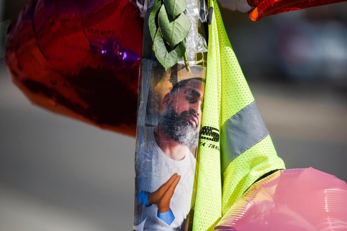 An image of Ethan Rivera makes up part of a memorial to the slain Charlotte Area Transit System bus driver along South Graham Street near West Trade Street in Charlotte.