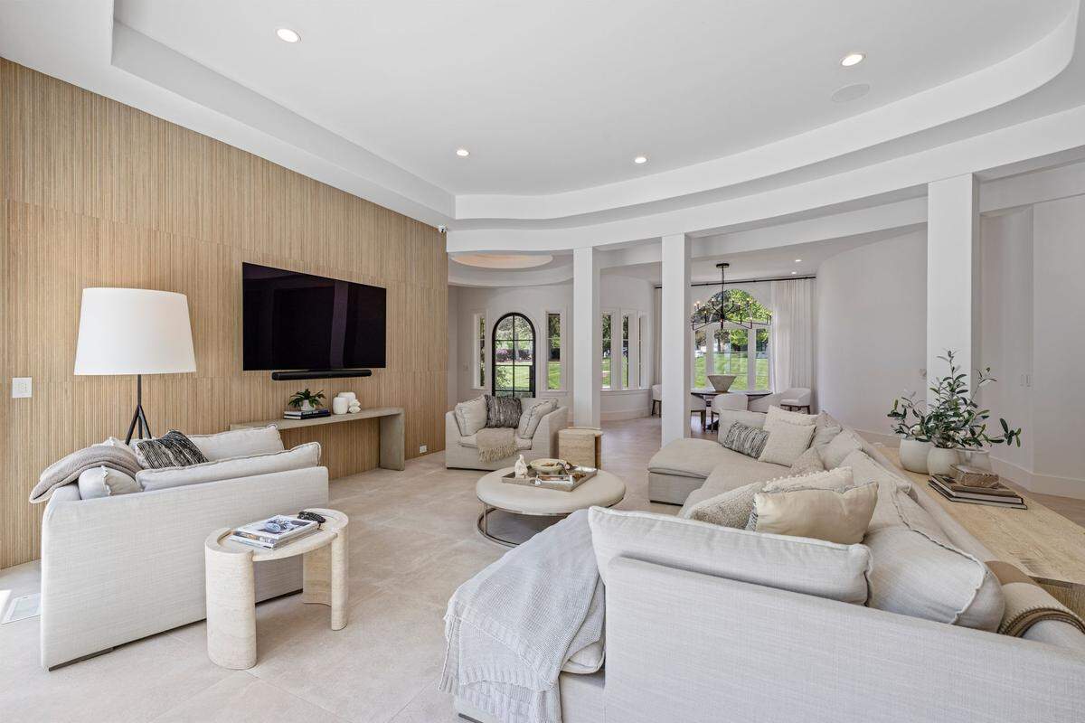 The home has designer lighting, Porcelanosa tile, honed quartz countertops and downstairs vanities handmade by Charlotte-based Mudwerk.