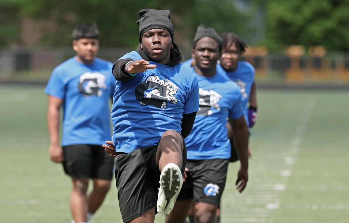 Garinger High football player Robert Shealey runs through drills during a workout on Tuesday, April 29, 2025.