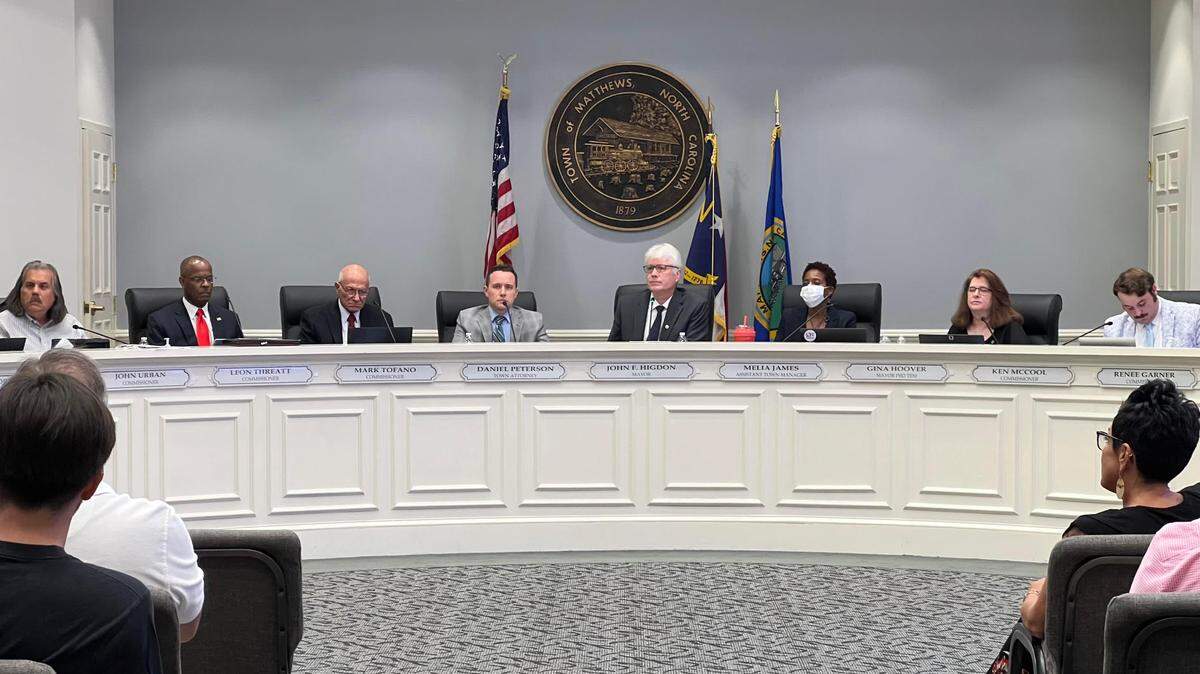 The Matthews Board of Commissioners debated and voted for a resolution disapproving a plan to fund public transit and other transportation with a sales tax increase during a meeting Monday.
