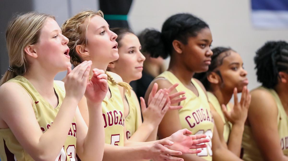 Canon teammates cheer on their team from the sideline