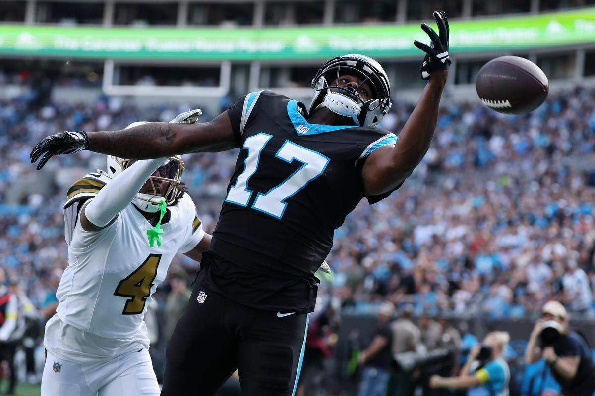 Carolina’s Xavier Legette fails to catch a pass under pressure from New Orleans’ Kool-Aid McKinstry during Sunday’s second half at Bank of America Stadium.