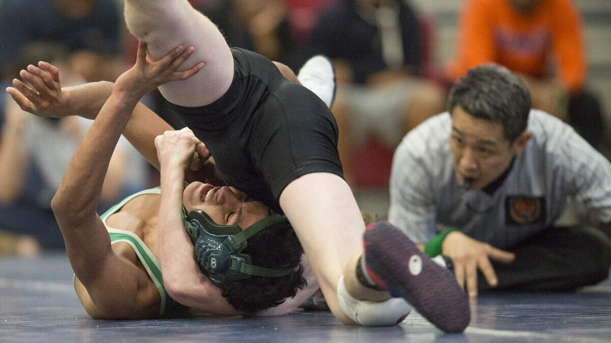 Hough High's Caleb Kreitter (away from camera) wrestles AL Brown's Daniel Cruz during the MECKA 4A wrestling championship Saturday, January 30, 2016 at Mallard Creek High School. Kreitter won by pin with 54 seconds left. Photo by JASON E. MICZEK - Special to the Observer