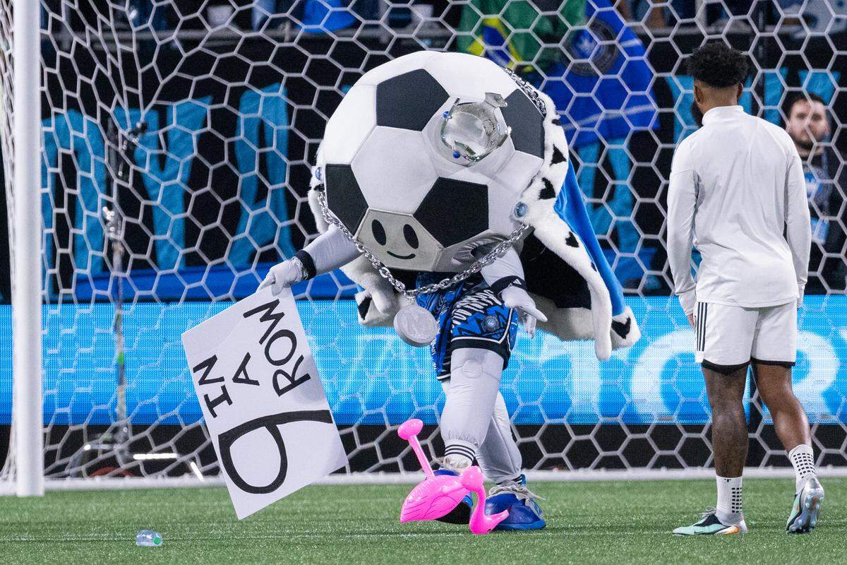 Charlotte FC mascot Minty kicks around a flamingo after defeating Inter Miami on Saturday at Bank of America Stadium. 