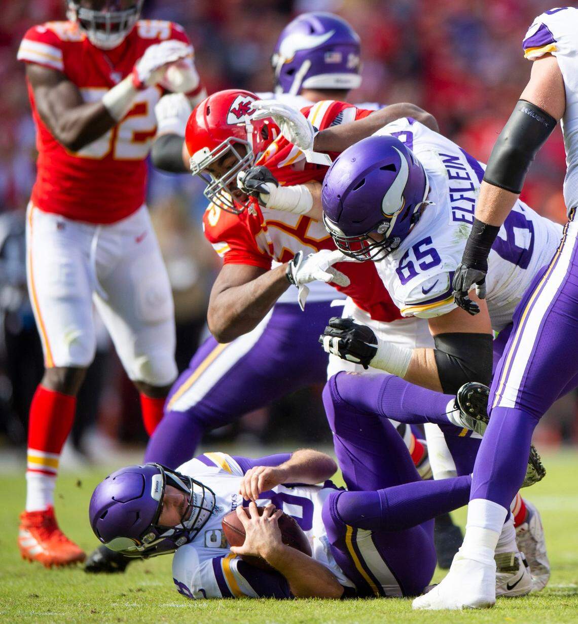 Kansas City Chiefs defensive end Chris Jones (95) sacks Minnesota Vikings quarterback Kirk Cousins (8) while Minnesota Vikings offensive guard Pat Elflein (65) blocks during the second quarter Sunday, Nov. 3, 2019, at Arrowhead Stadium.