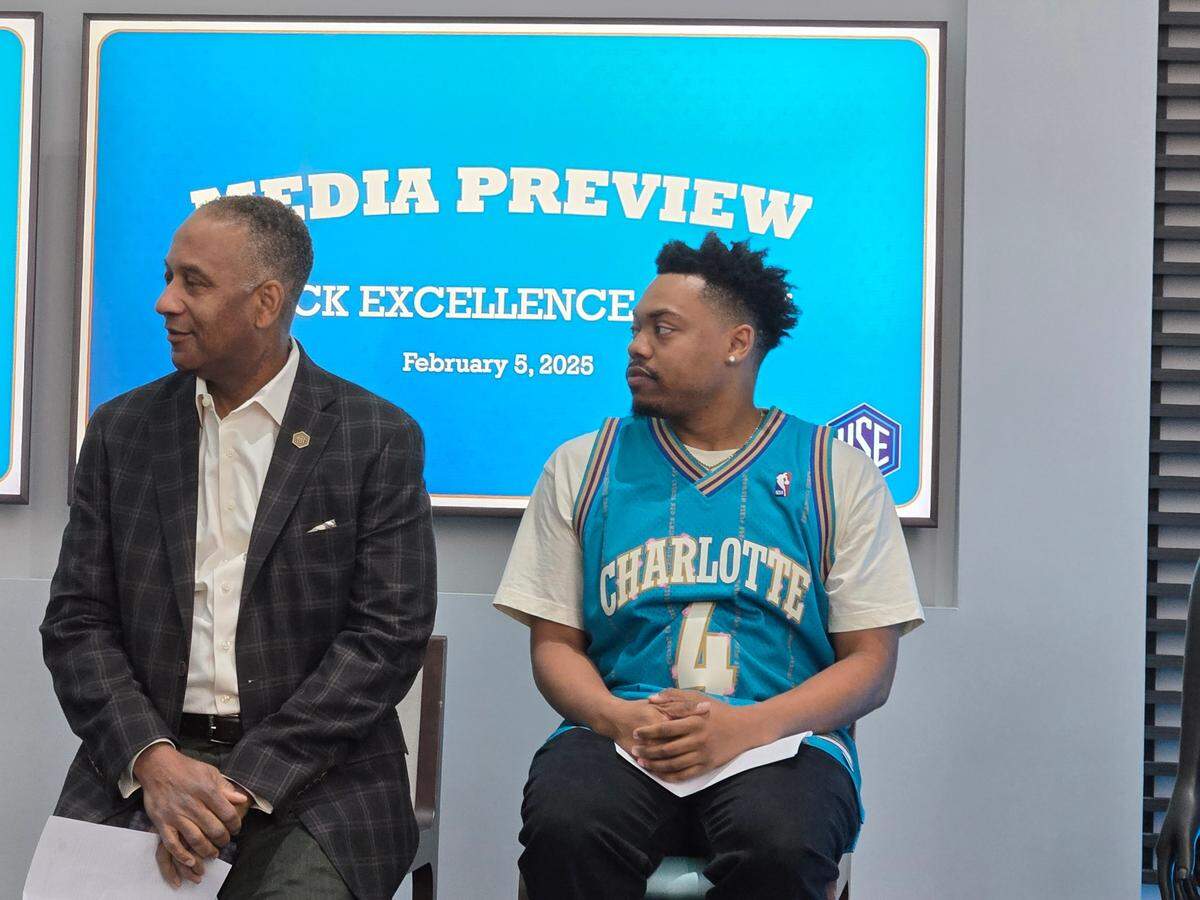 Seth Bennett, Chief Marketing Officer for the Charlotte Hornets (left), and digital designer Mike Jones talk about the newest Charlotte Hornets jersey, which represents Black excellence for Black History month. The uniform features the names of more than 20 prominent Black neighborhoods and streets of Charlotte’s past and present in pinstripe fashion, which mirrors the Hornets’ classic teal uniforms worn during the organization’s inaugural season until the design changed in 1996-97 season.