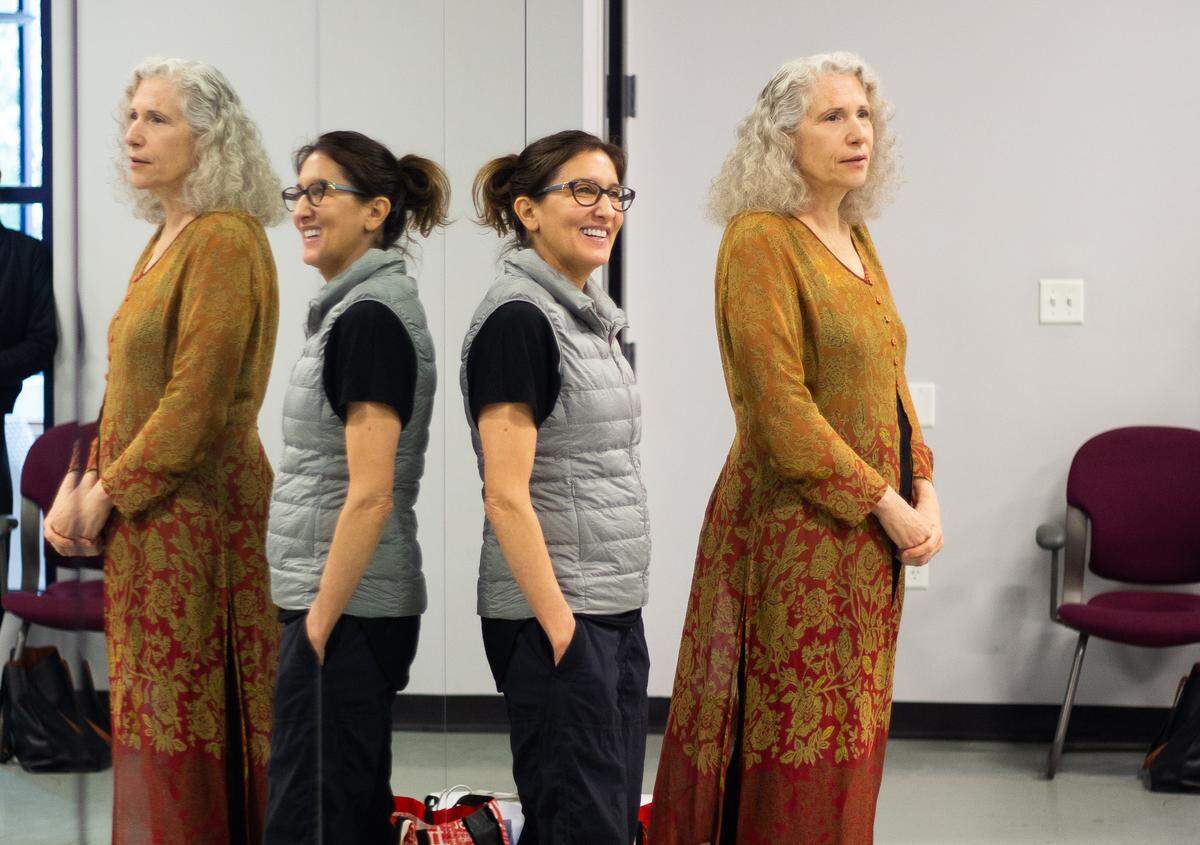 Choreographer Stephanie Martinez (in glasses) and dance historian and collaborator Dr. Lynne Conner direct Charlotte Ballet dancers in blocking before a rehearsal.