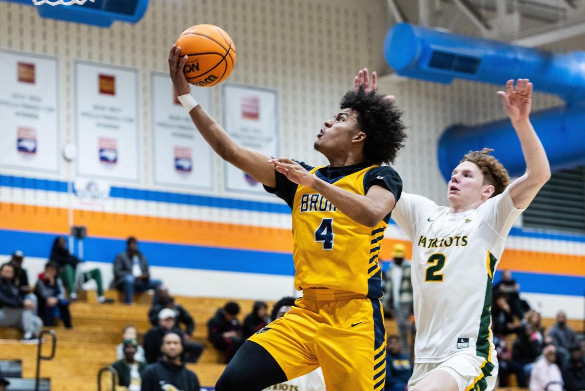 Lancaster Bruins Columbus Parker, left, shoots past Independence Patriots Ayden Davis during the Phenom Hoops New Year’s Bash at Marvin Ridge High School in Waxhaw, N.C., on Friday, December 27, 2024.