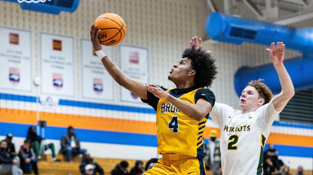 Lancaster Bruins Columbus Parker, left, shoots past Independence Patriots Ayden Davis during the Phenom Hoops New Year’s Bash at Marvin Ridge High School in Waxhaw, N.C., on Friday, December 27, 2024.